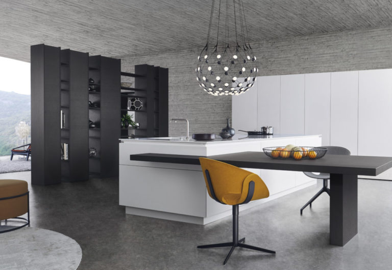 alt="Full kitchen view of island with CLASSIC-FS matte-lacquer white merino surface with TOPOS oak veneered table extension"