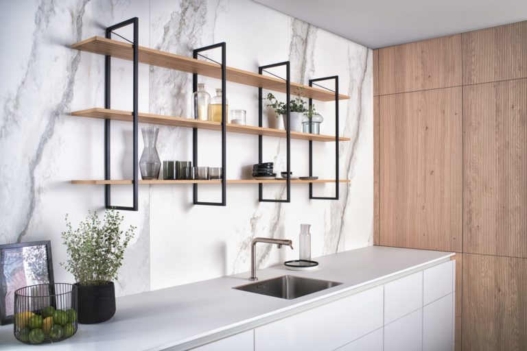 alt="Close up of suspended modular shelves over FENIX frosty white work top"