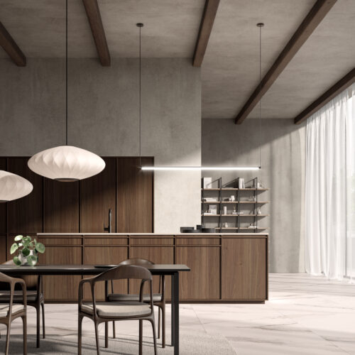alt="front kitchen view of island and talls with walnut paneling, and open wall shelving in the background"